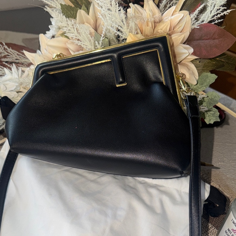 Chic Black Crossbody Bag with Gold Accents